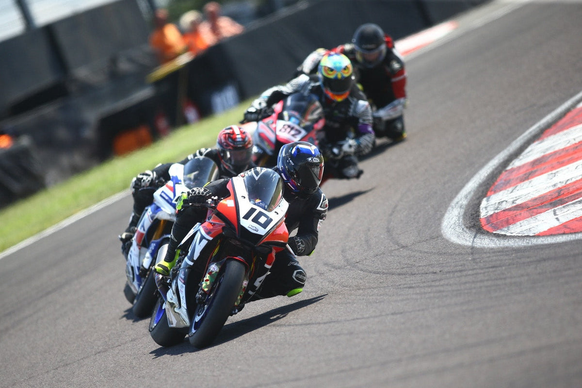 Motorcycle race with racers on a track